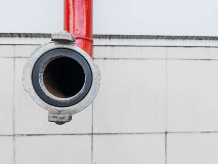 Red fire-fighting pipeline with a close-up lockの写真素材