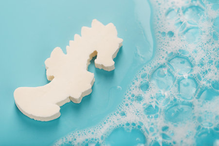 White soap in the shape of a seahorse with foamの写真素材