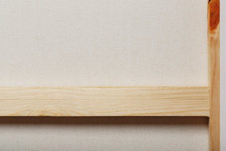 Canvas for drawing mounted on a wooden rail, as a backgroundの写真素材