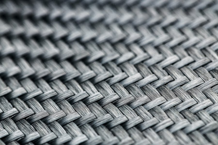 Horizontal photo of textured black carbon fiber panel