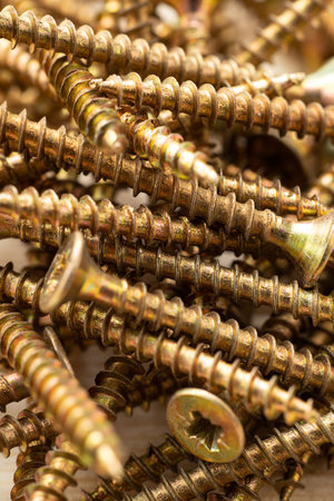 Texture of a pile of wood screws, full screen macroの写真素材
