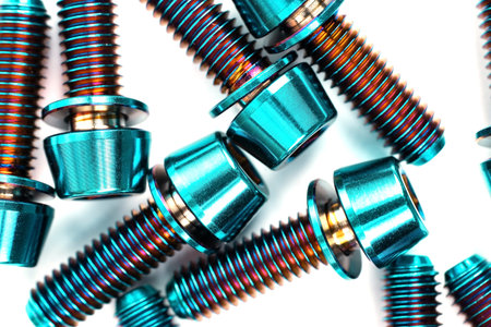 Blue titanium hexagonal bolts on a white background