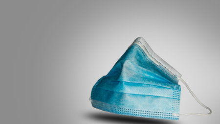 Surgical mask isolated with negative space, grey background