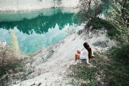 beautiful girl in underwear and sweater near the lakeの写真素材