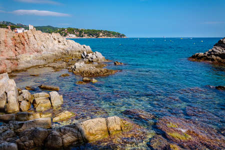 panoramic view of seashore with rock cliff in Costa Brava, Spainの写真素材