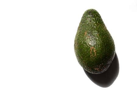 whole green avocado nut on a white background top viewの写真素材