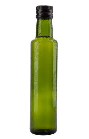 Grren bootle with drops isolated on whiteの写真素材