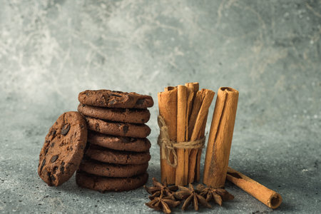tasty healthy cookies and cinnamon and anise on the table