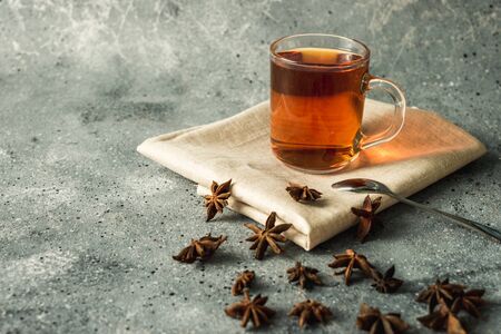 cup of black tea with cinnamon and star aniseの写真素材