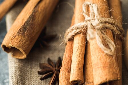 cinnamon sticks and star anise on eco backgroundの写真素材
