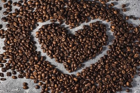 coffee beans on burlap background with copy space for textの写真素材