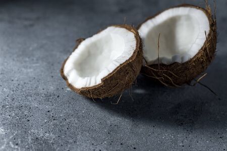ripe chopped coconut on a gray stone background.の写真素材