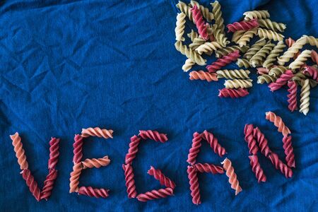 vegetarian pasta on a dark classic blue background copy spaceの写真素材