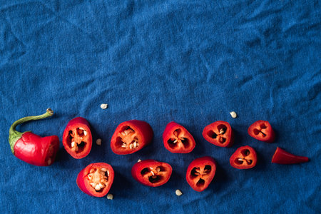 Red chili peppers close-up on classic blue background copy space