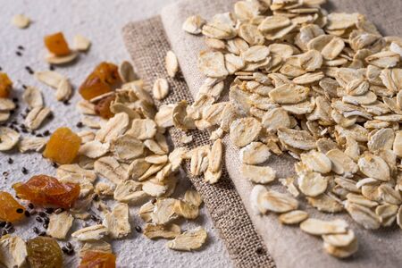 Bowl with useful oatmeal on a light background. The concept of cooking oatmeal. healthy food. dietの写真素材