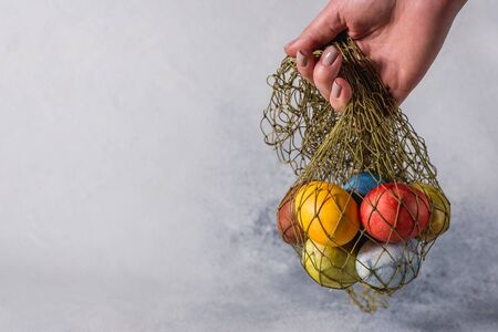 Multi-colored bright easter eggs. Easter eggs on a light background symbol. Christ is risen copyspace close-upの写真素材