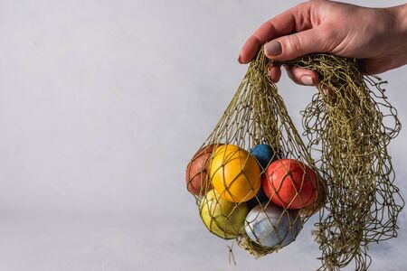 Multi-colored bright easter eggs. Easter eggs on a light background symbol. Christ is risen copyspace close-upの写真素材