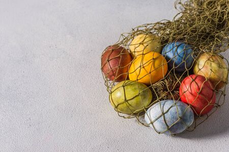 Multi-colored bright easter eggs. Easter eggs on a light background symbol. Christ is risen copyspace close-upの写真素材