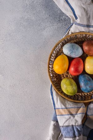 Multi-colored bright easter eggs. Easter eggs on a light background symbol. Christ is risen copyspace close-upの写真素材