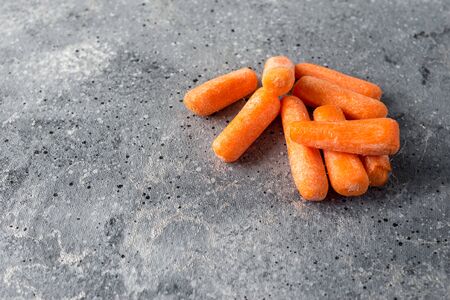 Bunch of fresh healthy carrots vitamins on a light gray backgroundの写真素材