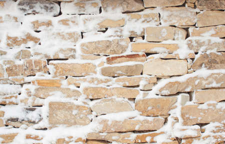 Stone wall pattern in winterの写真素材
