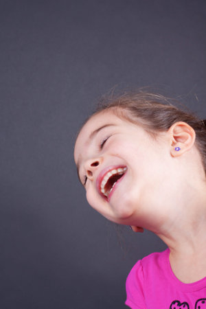 Happy girl portrait on black
