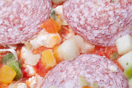 Frozen pizza with salami and vegitablesの写真素材