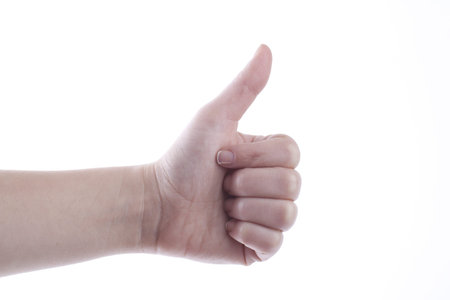 Woman hand showing thumb up