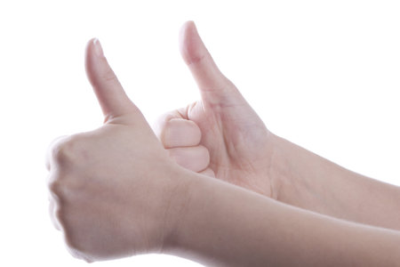 Woman is showing thumb up with two hands