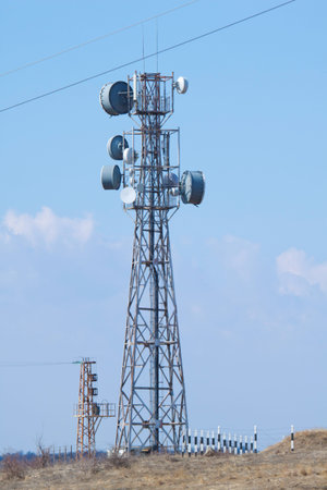 Telecomunication tower against blue sky.