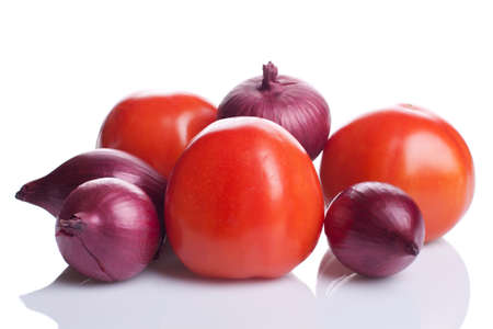 Tomatoes and onions isolated on whiteの写真素材