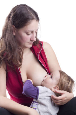 Mother breast feeding her little girlの写真素材