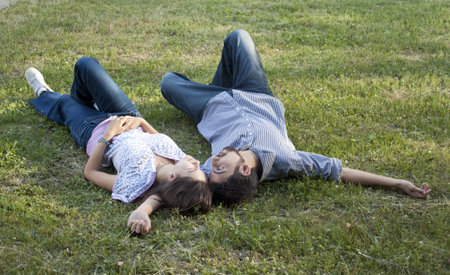 Young couple lying on the ground