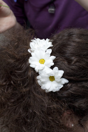 Woman at hairstylist. Hairstyle with flowers.の写真素材