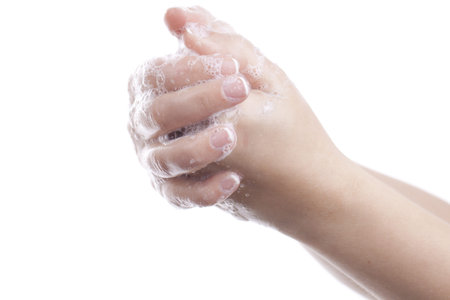 Woman washing her hands isolated.
