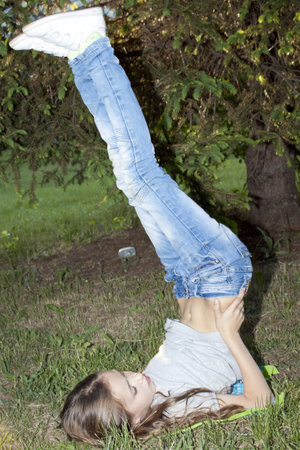 Little girl lying on the grass