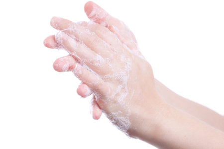 Woman washing her hands isolated.
