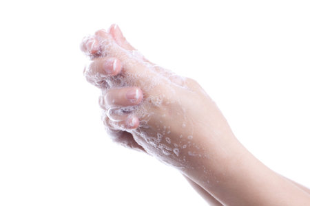 Woman washing her hands isolated.
