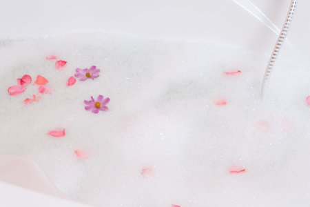 Bubble bath tub with flowersの写真素材