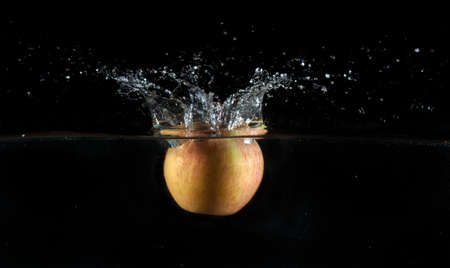 Apple water splash. High speed photography.の写真素材