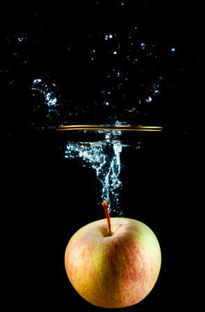 Apple water splash. High speed photographyの写真素材