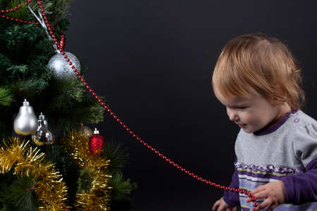 Little girl with cristmas toysの写真素材
