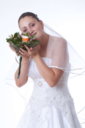 Bride in white holding a boquet isolatedの写真素材