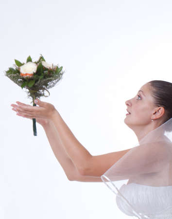 Bride in white holding a boquet isolatedの写真素材