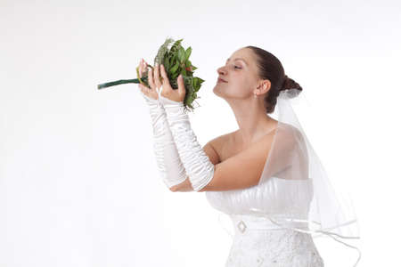 Bride in white holding a bouquet. Isolatedの写真素材