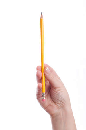 Woman hand is holding a pencil isolated on whiteの写真素材