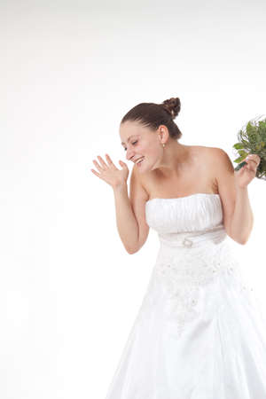 Bride in white dress with bouquet isolatedの写真素材