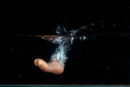 Carrot water splash. High speed photography 