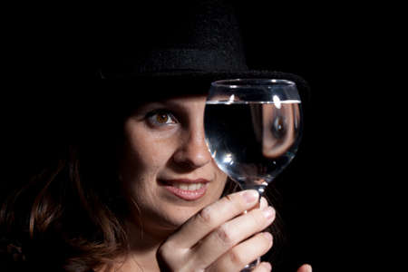 Woman with glass full of wine. Studio shot.の写真素材