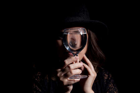 Woman with glass full of wine. Studio shot.の写真素材